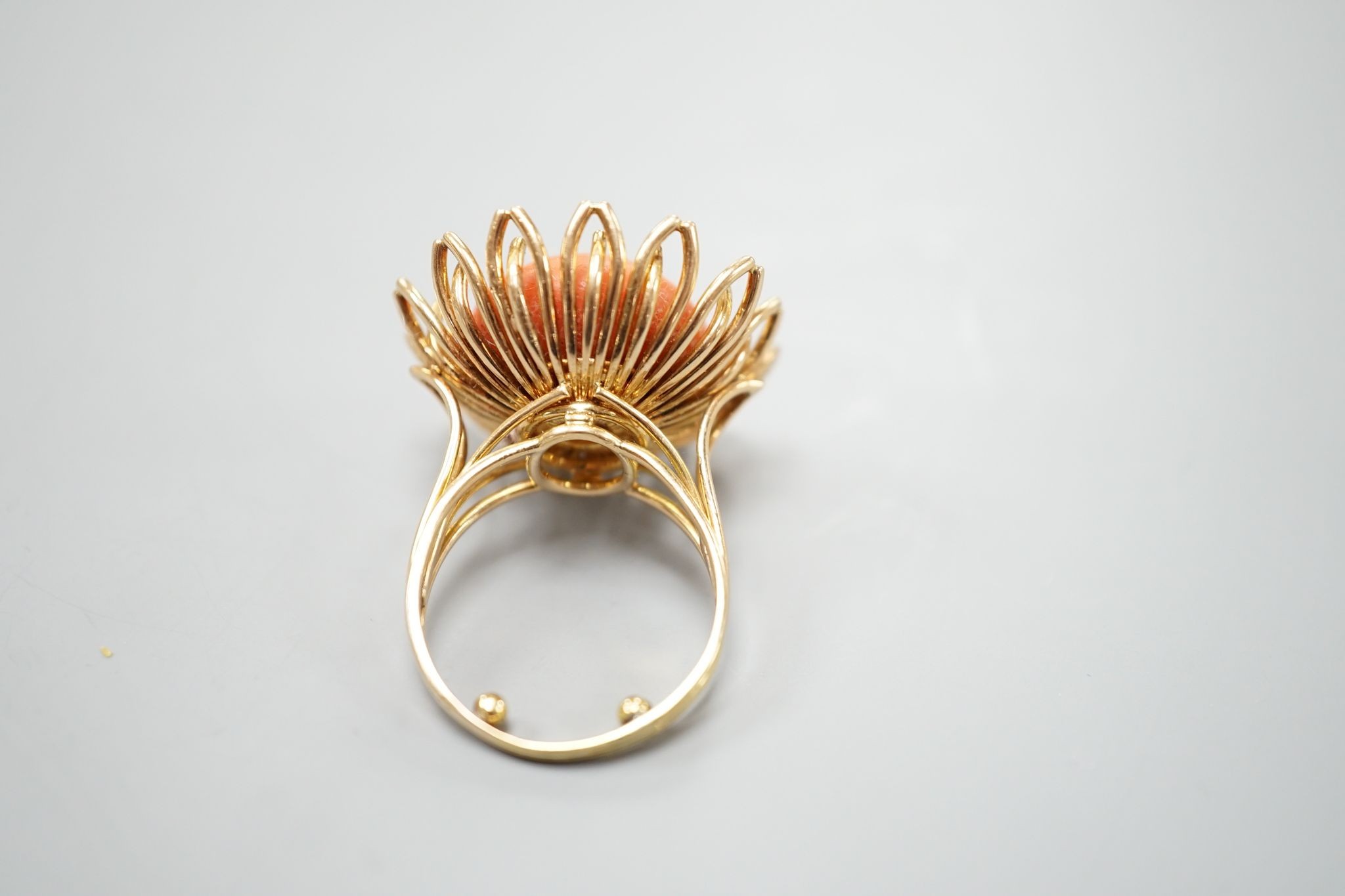 A modern yellow metal and button shaped coral bead set dress ring, size L, gross weight 13.4 grams.